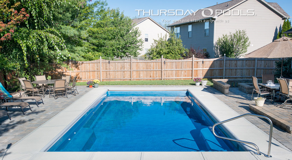 goliath fiberglass pool in backyard